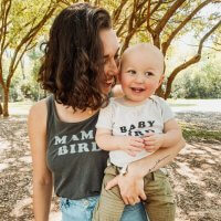Mom and 1 year old happy in park