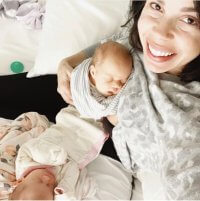 mom breastfeeding twins