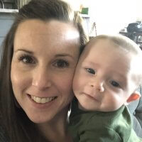 mom and baby in happy nursing relationship